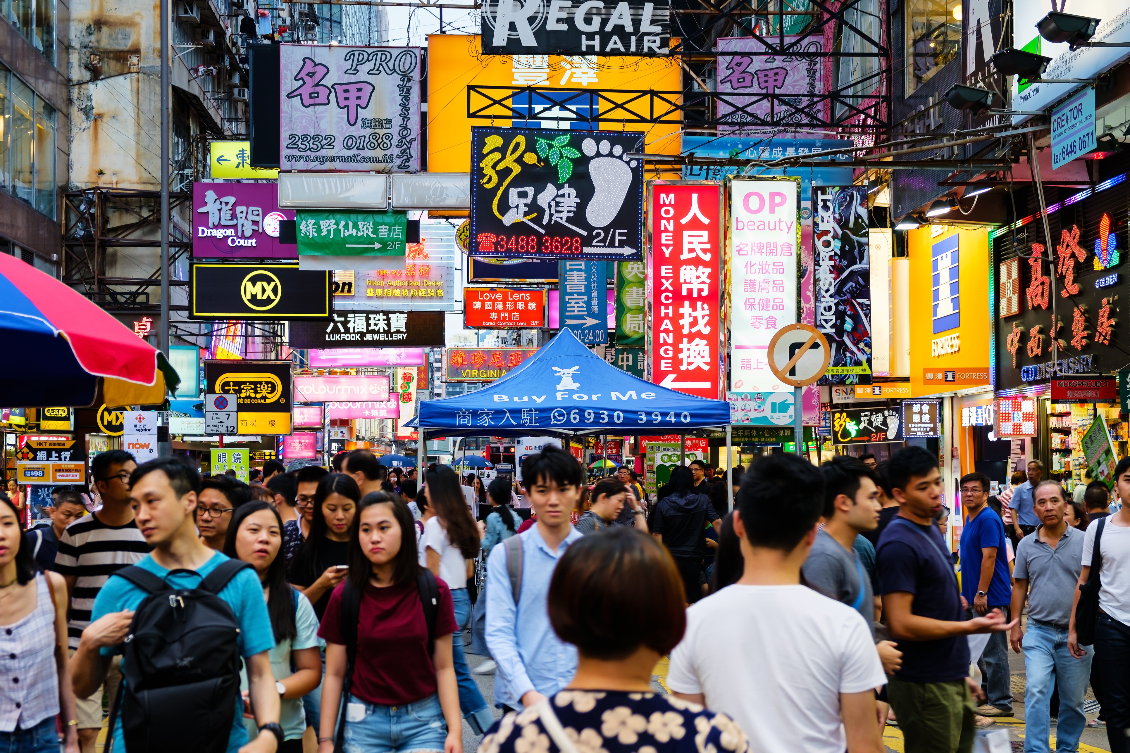 People walk through the streets of Hong Kong