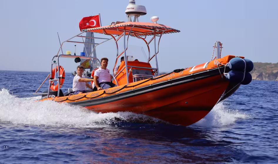 A small boat flying the Turkish flag at sea
