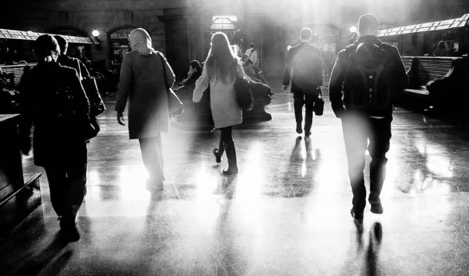 People in transit in a train station