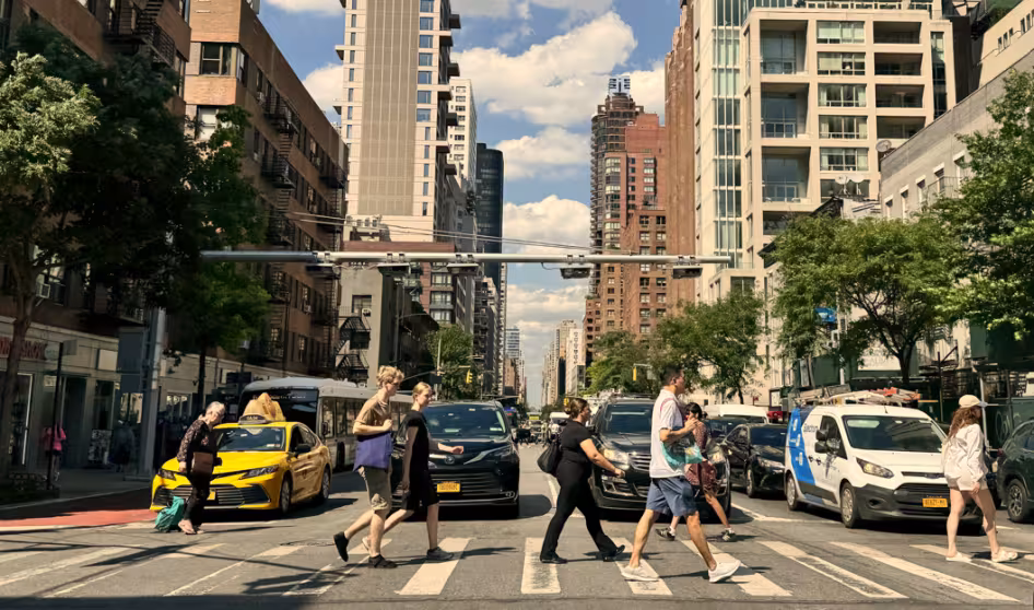People at a pedestrian crosswalk crossing the street