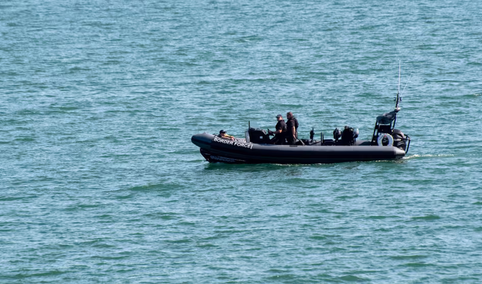 UK Border Patrol personnel in an inflatable boat 