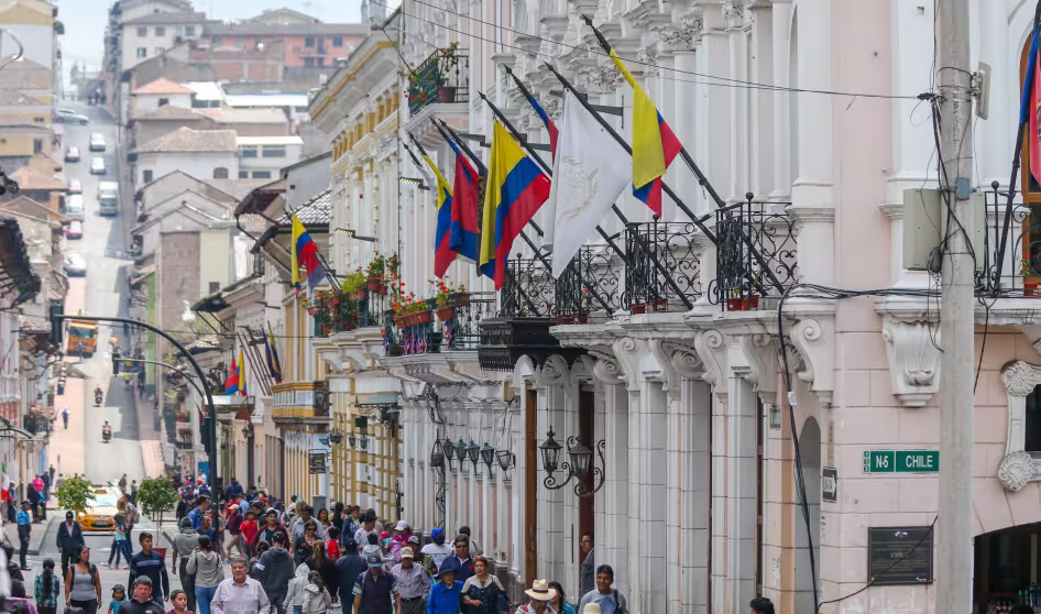 Many people walking along a busy street in Quito, Ecuador