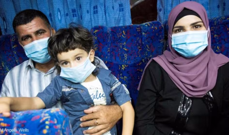 A family wearing face masks