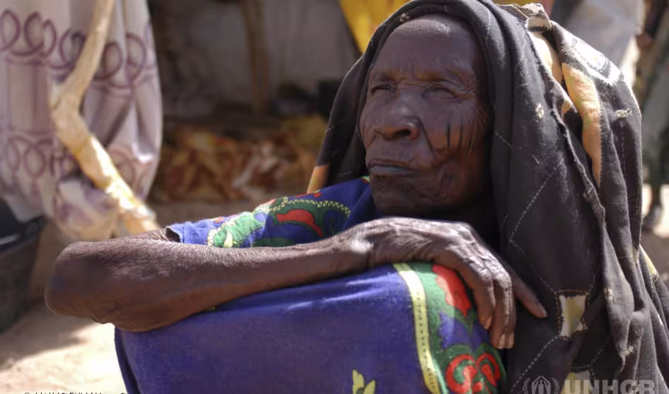 An elderly refugee woman