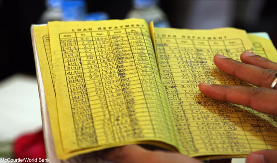 A yellow paper showing rows of loan information