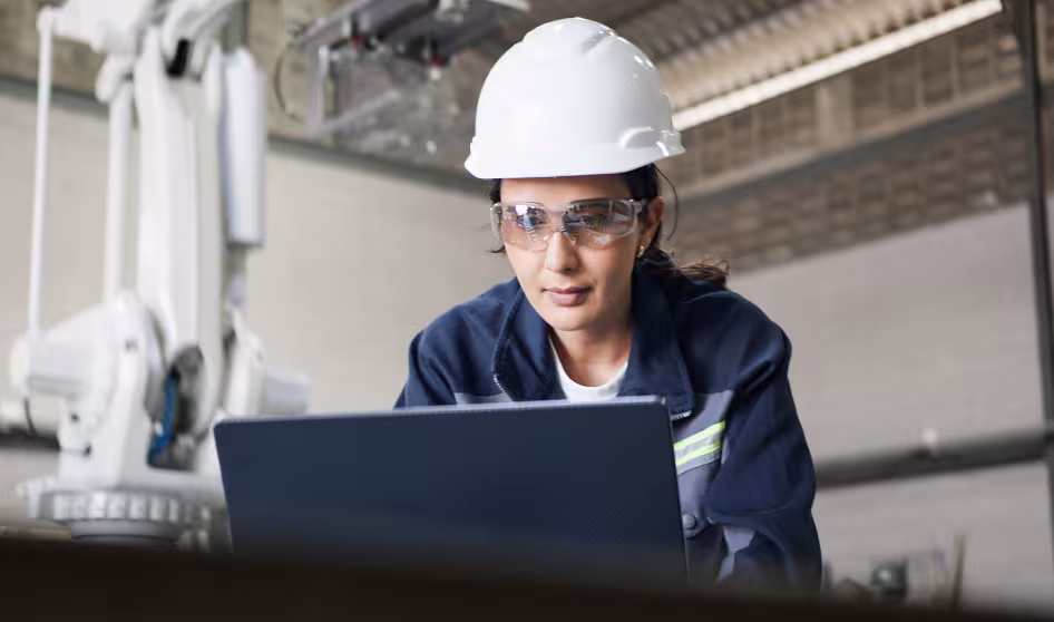 An industrial engineer working in a robotics factory.