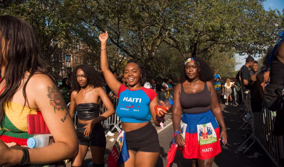 Young women smiling and dancing in the street
