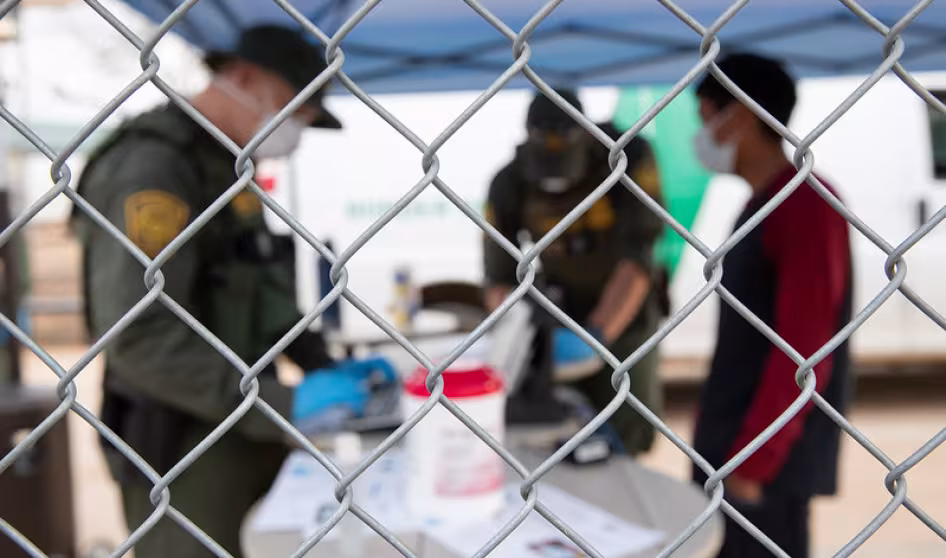 U.S. Border Patrol agents prepare to process migrant encountered near Arizona
