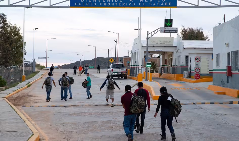 Photo of individuals re-entering Mexico after U.S. expulsion