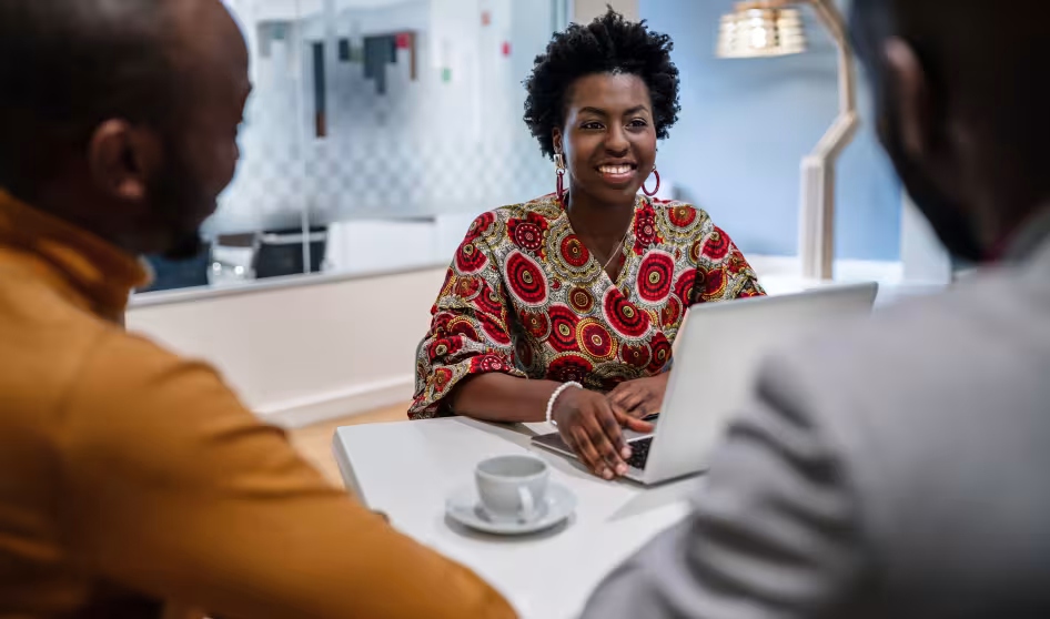 A Black female financial advisor in a meeting.