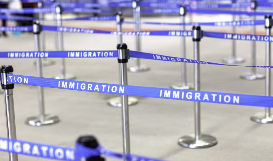 An image of an immigration boarding line.