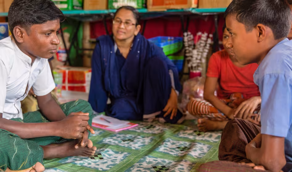 Rohingya children sit in Child Friendly Spaces in Cox's Bazar, Bangladesh