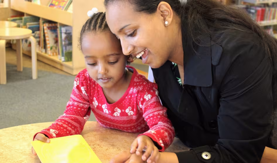 Mother and child reading.
