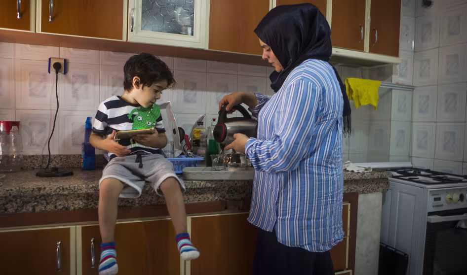 A refugee woman and child at home in Turkey