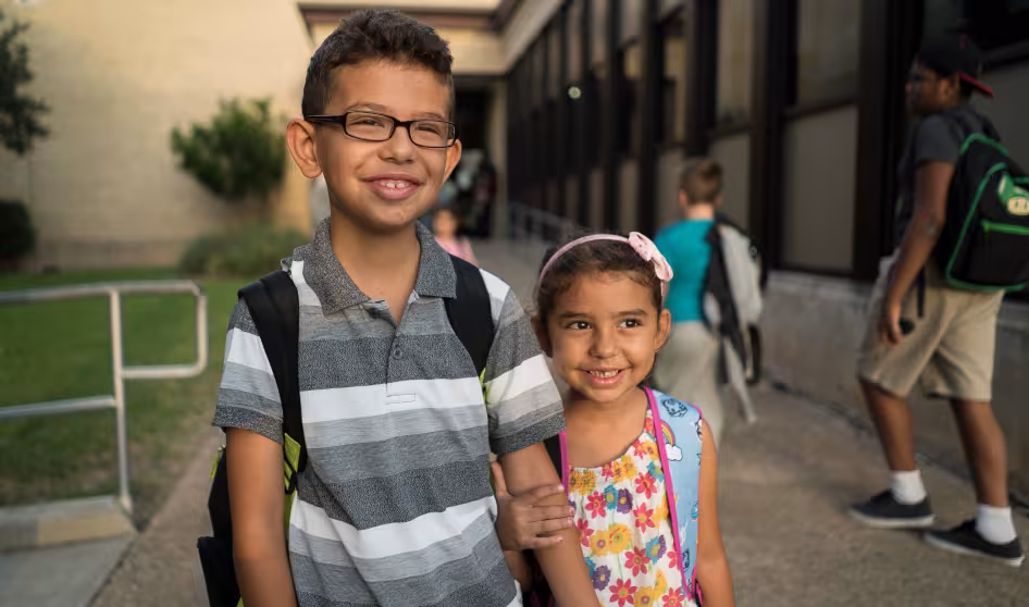 A brother and sister at school