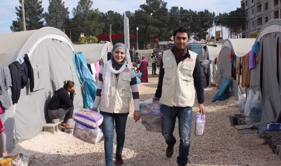 Families at Syrian refugee camp in Suruc, Turkey receive relief supplies