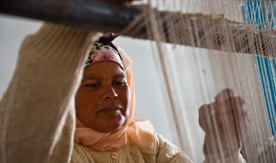 A woman in training center for production of local handicrafts.