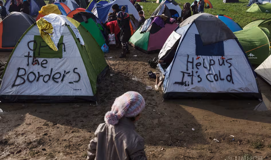 Refugees in makeshift camp on the border between Greece and the Former Yugoslav Republic of Macedonia.
