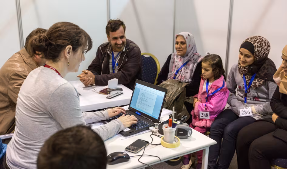 A Syrian family is interviewed by Canadian officials.