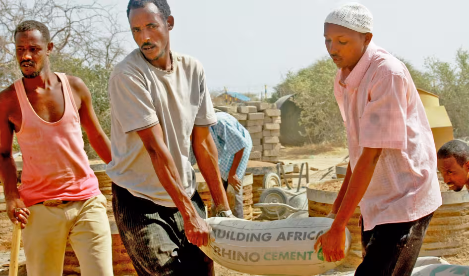 Men building latrines in Dadaab refugee camp in Kenya. 