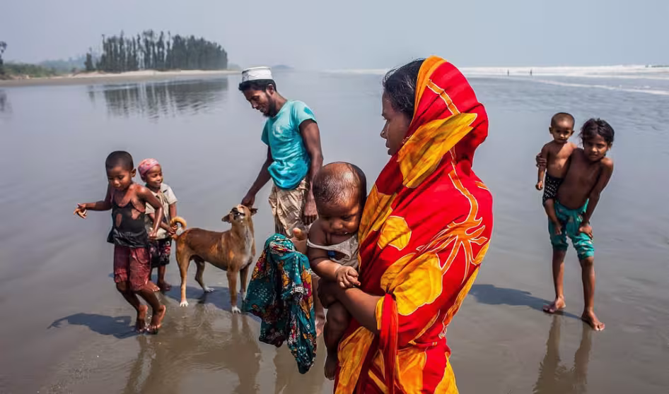 Rohingya family on beach in Teknaf.