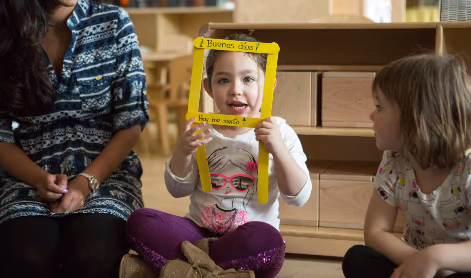 A preschool student shares how she feels during a morning greeting song