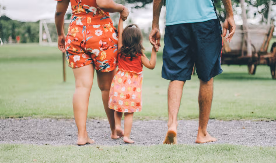 A young child and family walking