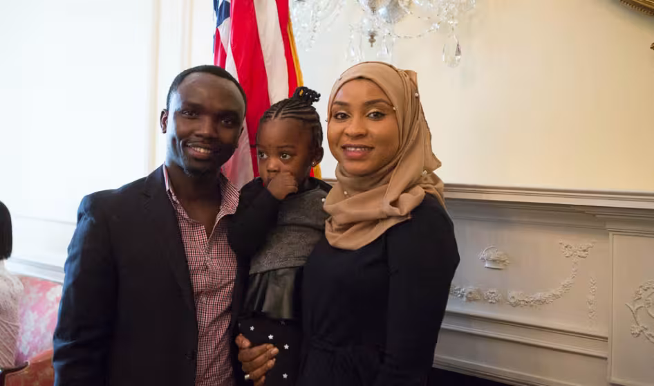 Parents and their young child at a naturalization service.