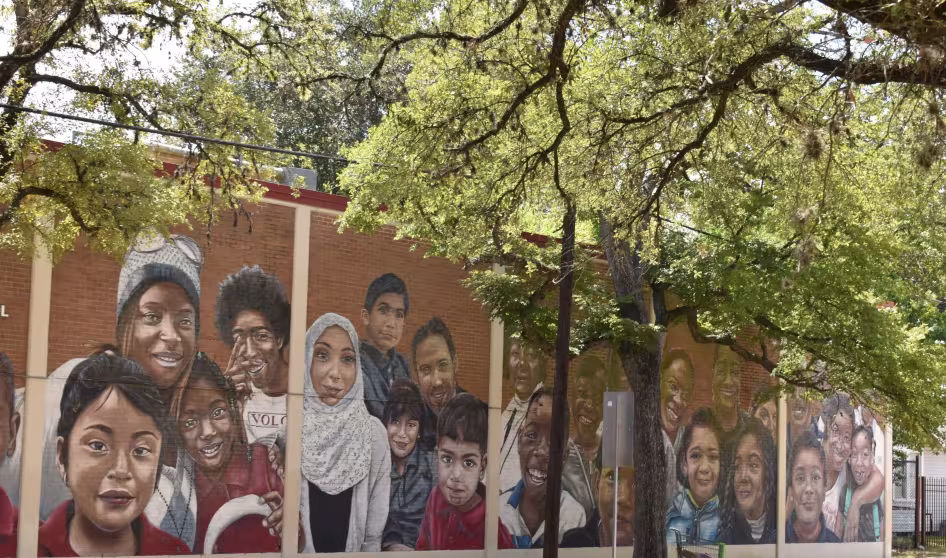 A mural on a Houston elementary school showing children of different backgrounds