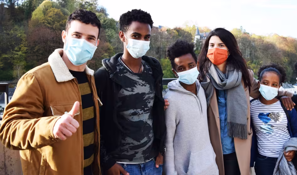 JRS Europe volunteers and young refugees wearing face masks visit a site in Luxembourg