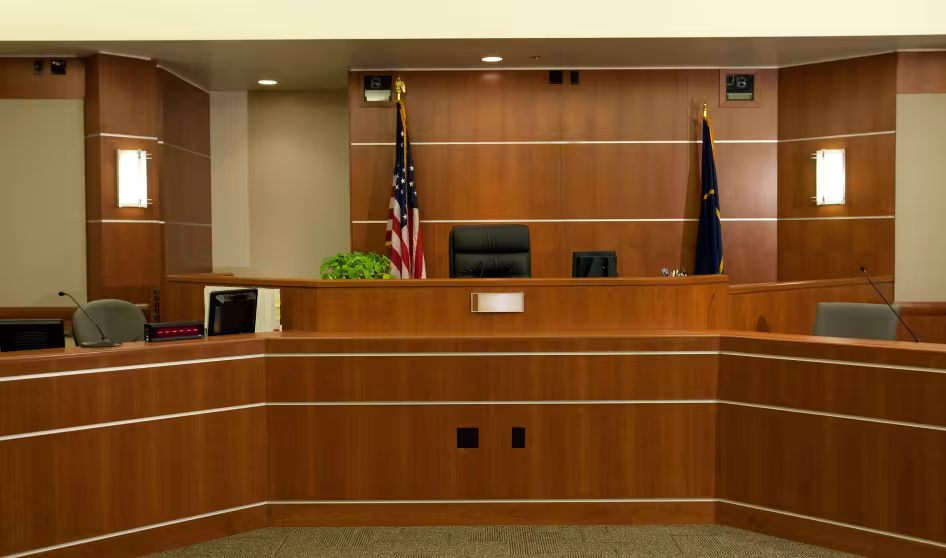 A modern courtroom with the U.S. flag