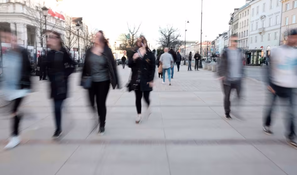 Blurred photo of people walking in Warsaw, Poland
