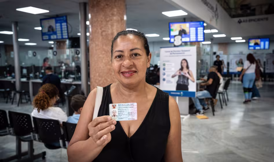 A woman displays her temporary visa issued in Peru.