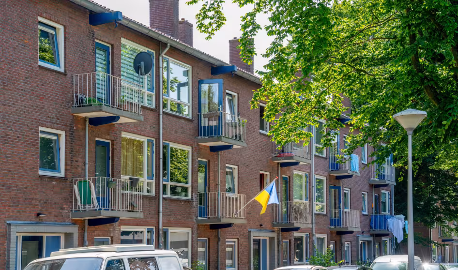 Ukraine flag hanging from an apartment building in the Netherlands