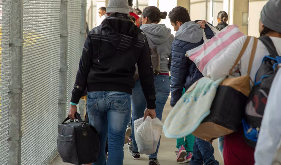 Inadmissible migrants, some seeking asylum, are processed by CBP officers