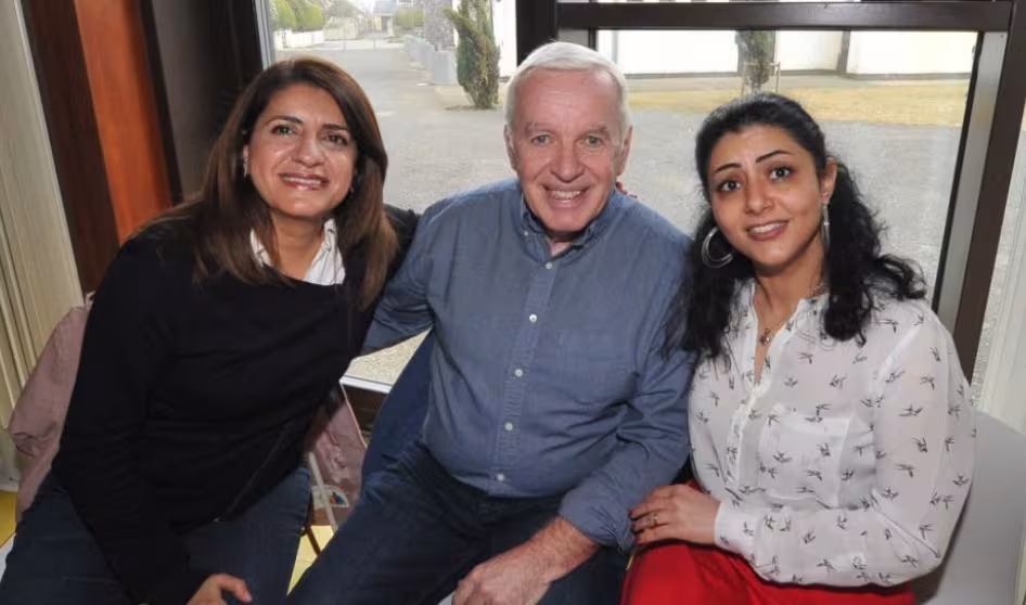 A Syrian refugee sits with her new neighbors in Ireland