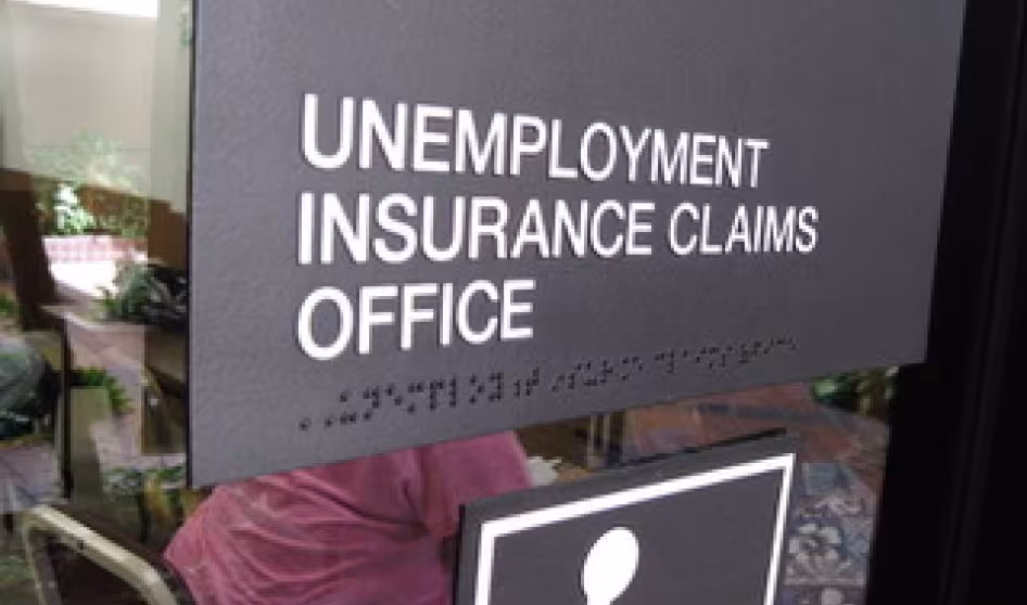 Sign on the window of an unemployment insurance claims office