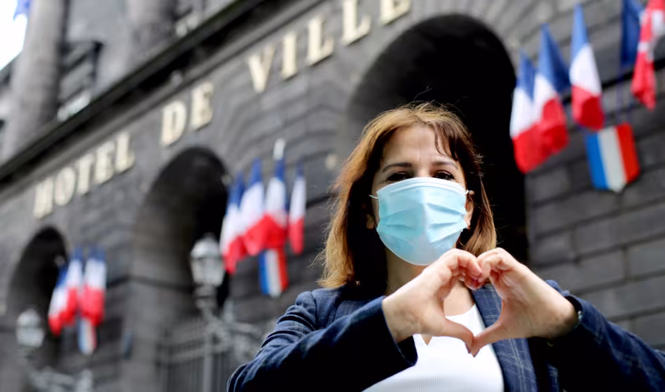 A Syrian refugee in France who has been assisting her neighbors during the pandemic