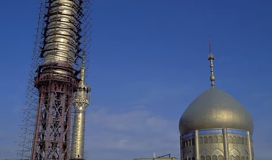 Scaffolding surrounds a mosque in Iran.