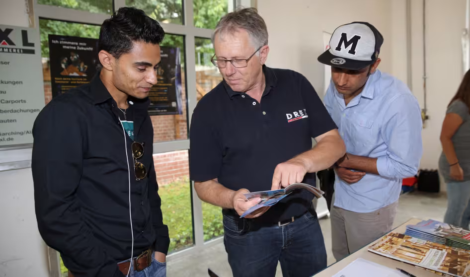 Refugees attend a job training fair