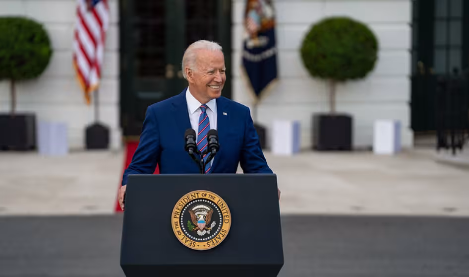 Photo of U.S. President Joe Biden delivering remarks in front of White House.