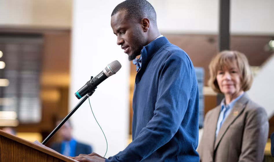 Image of aspiring pastor and DACA recipient speaking at DACA event in Minneapolis