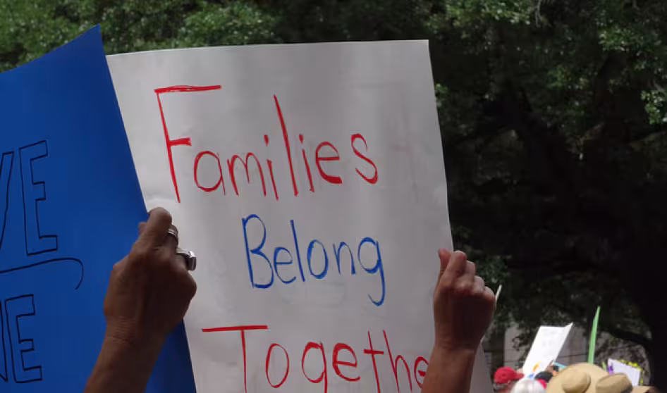 Image of families belong together event banner in Houston