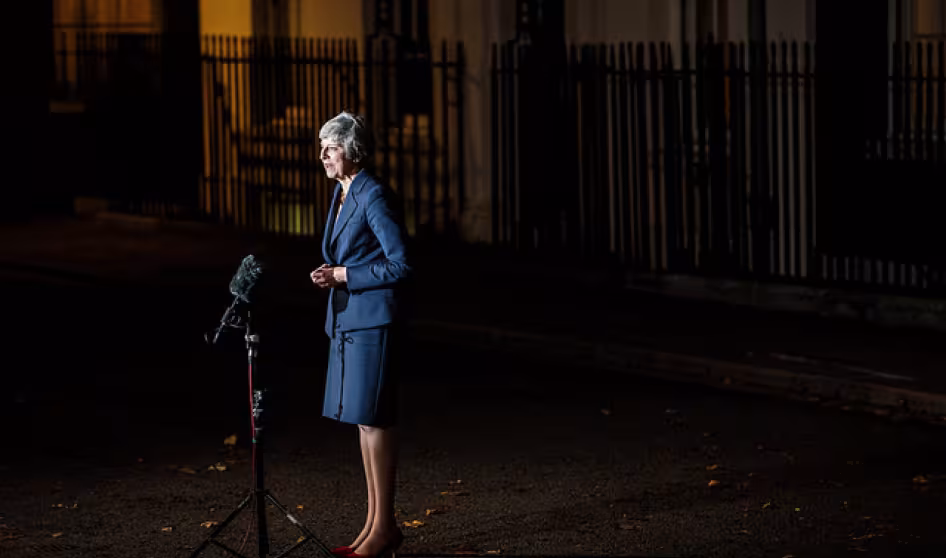 Theresa May speaks to reporters