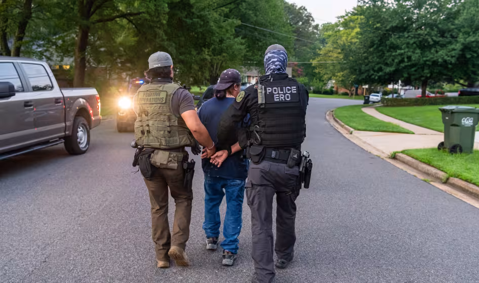 Federal immigration officers make an arrest during an operation in Virginia.