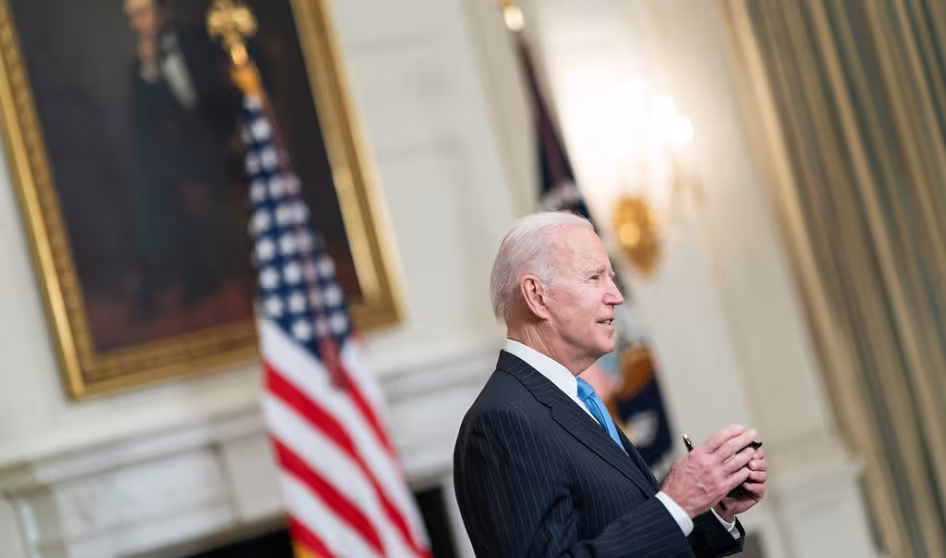 President Joe Biden speaks to journalists at the White House.