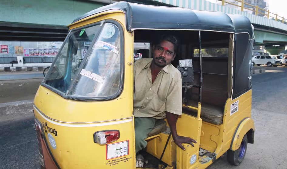 A tuk tuk driver in India.