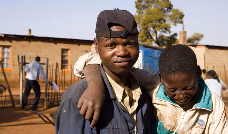 Two boys pose in an informal settlement east of Johannesburg largely populated by immigrants.