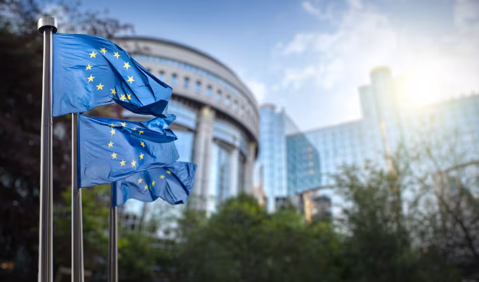 Flags of the European Union fly outside of the European Parliament in Brussels.