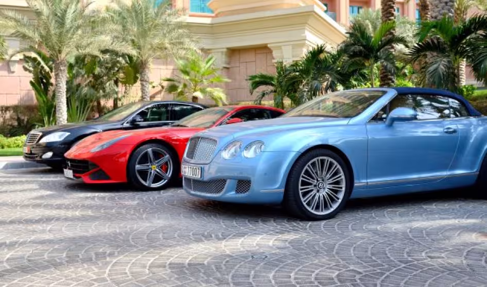 Luxury cars in front of a hotel on Dubai's Palm Jumeirah.